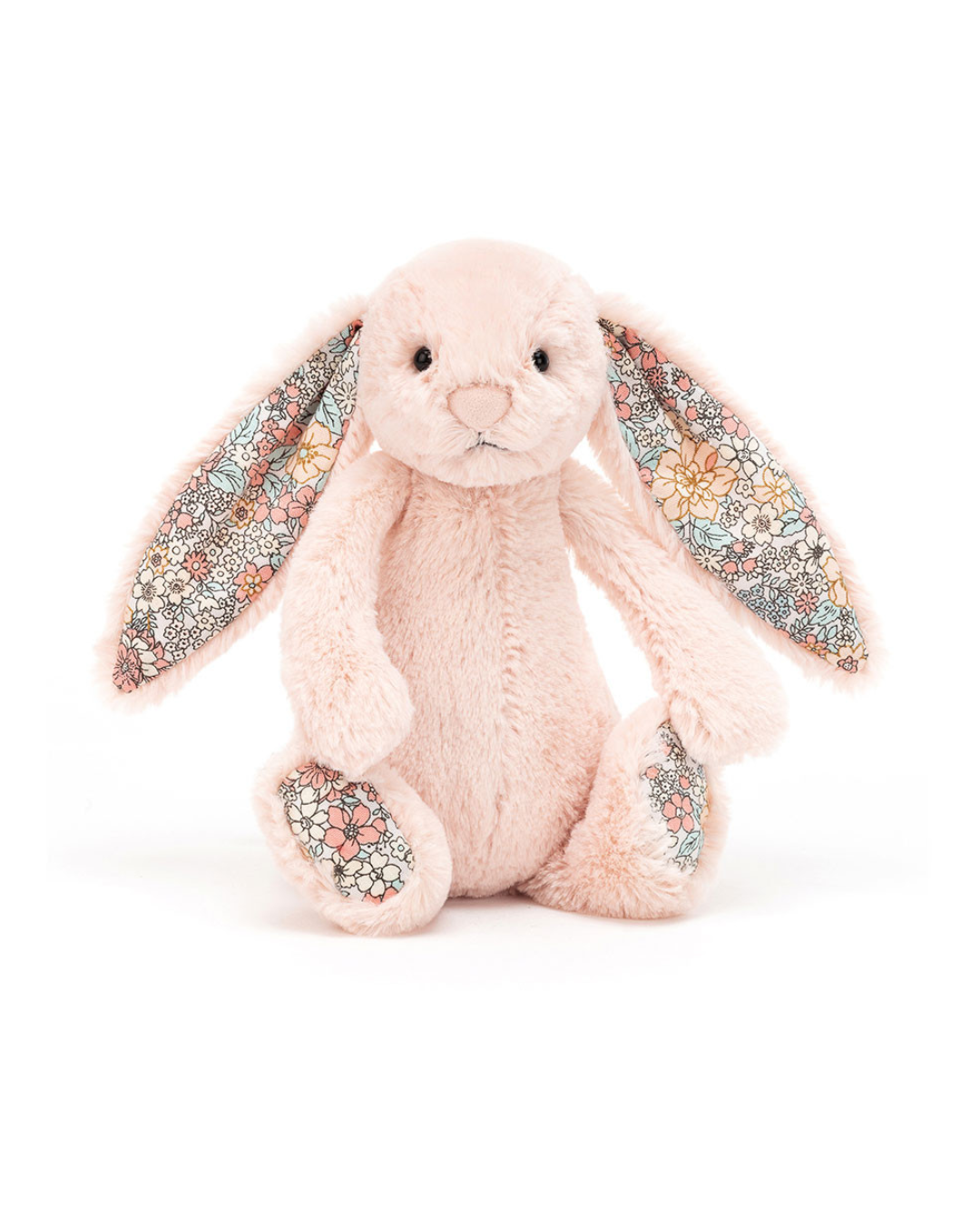 A plush stuffed bunny in pale pink with long ears and floral-patterned inner ears, feet, and paw pads, photographed on a clean white background.