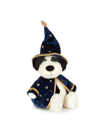 A plush puppy dressed as a wizard, featuring a navy blue velvet robe with gold star patterns and trim, and a matching pointed wizard hat, set against a plain white background.