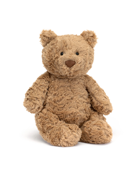 A plush teddy bear in a warm tan-brown color, sitting upright against a clean white background.
