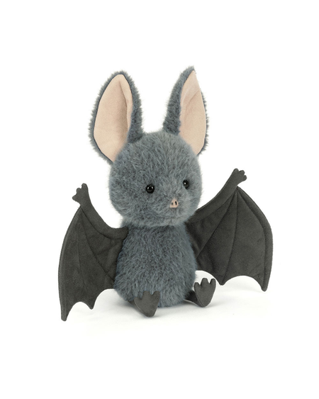 A plush toy bat in dark gray with large pale pink inner ears and dark gray wings, sitting against a plain white background.
