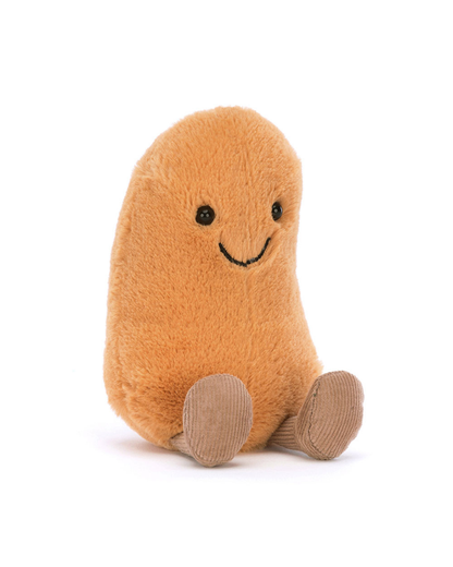 A plush potato-shaped toy in a warm orange-brown color with a simple black embroidered smiley face and tan corduroy feet, photographed on a clean white background.