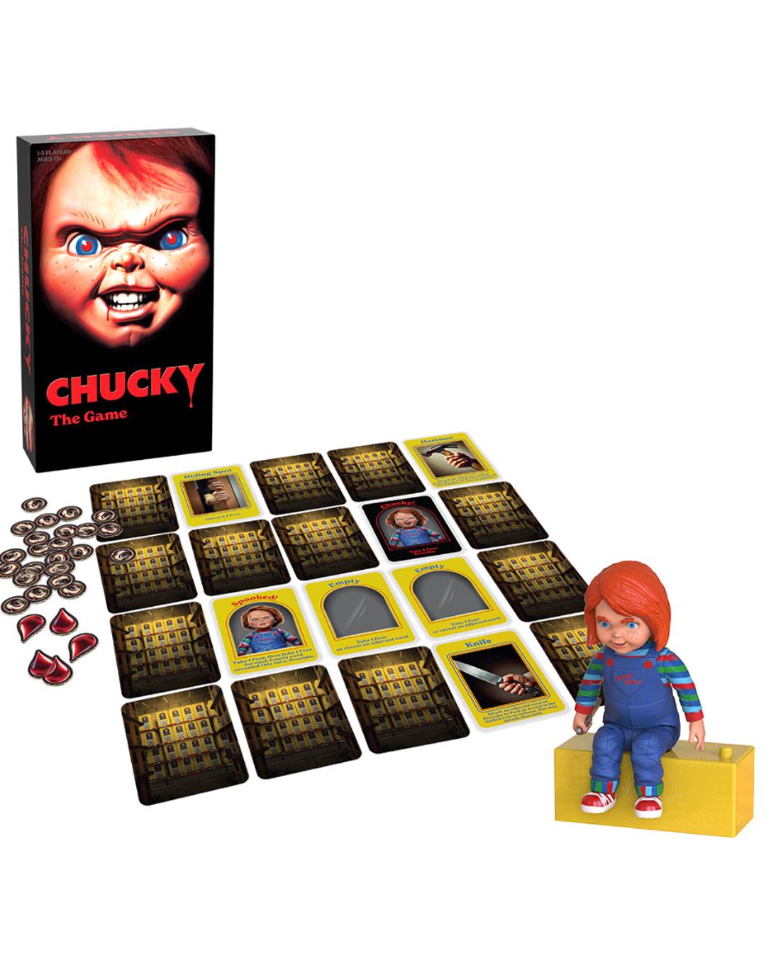 Chucky 'The Game' board game set displayed on a white background, including the illustrated game box, multiple cards, red dice, and a Chucky doll figure sitting on a yellow block.