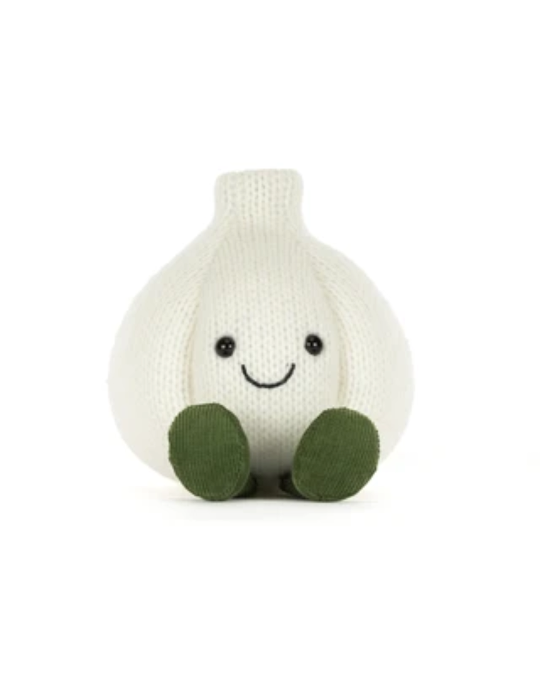A knitted garlic plush toy with a smiling face and olive green feet, photographed against a seamless white background.