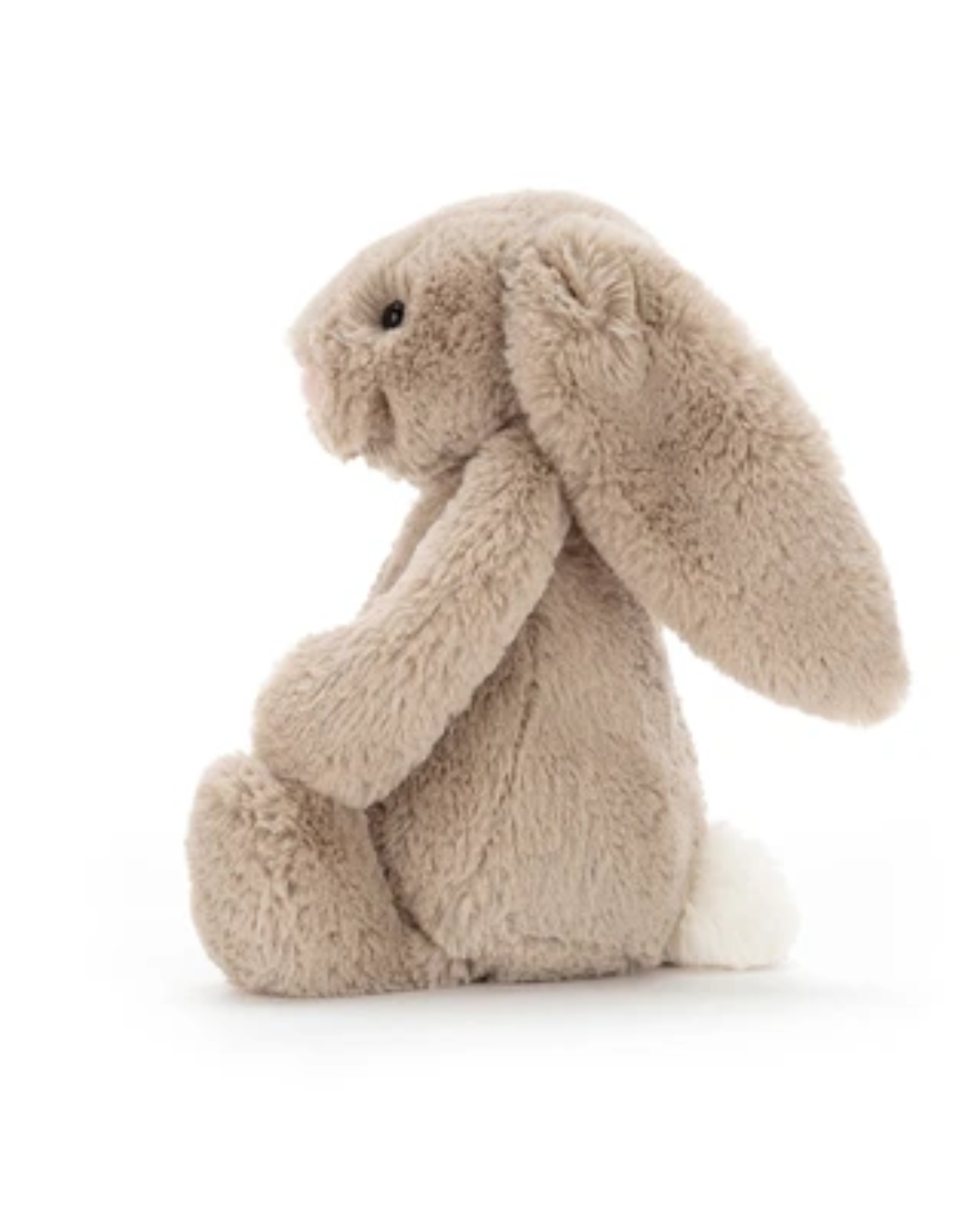 A plush stuffed bunny in a warm taupe-beige color with a white tail, sitting on a seamless white background.