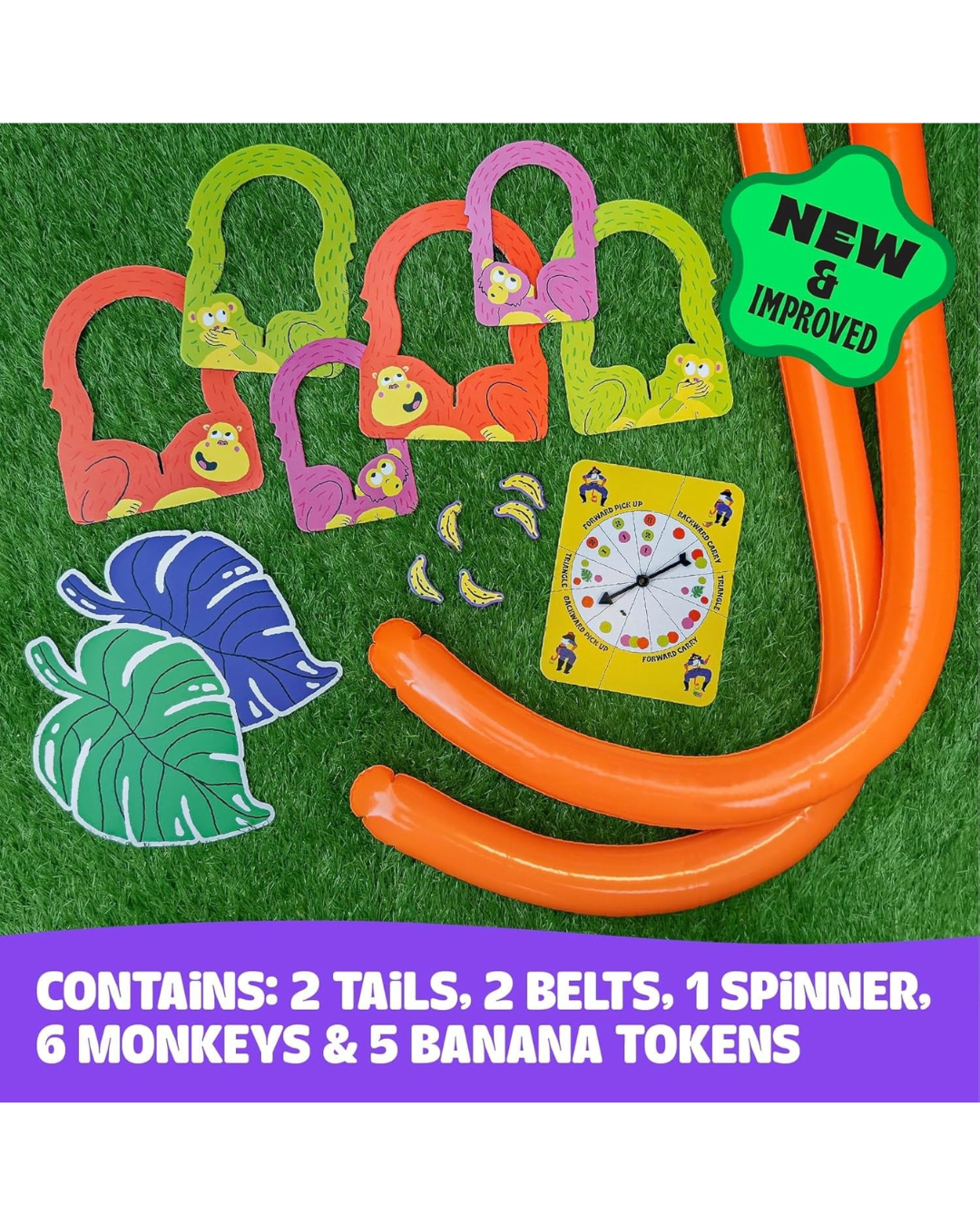 A colorful monkey-themed game set laid out on green artificial grass, including orange tails, multiple colored monkey-shaped belts with banana face details, a yellow spinner card, banana tokens, and two tropical leaf-shaped items. A green badge says 'NEW & IMPROVED,' and a purple text bar at the bottom lists included pieces.