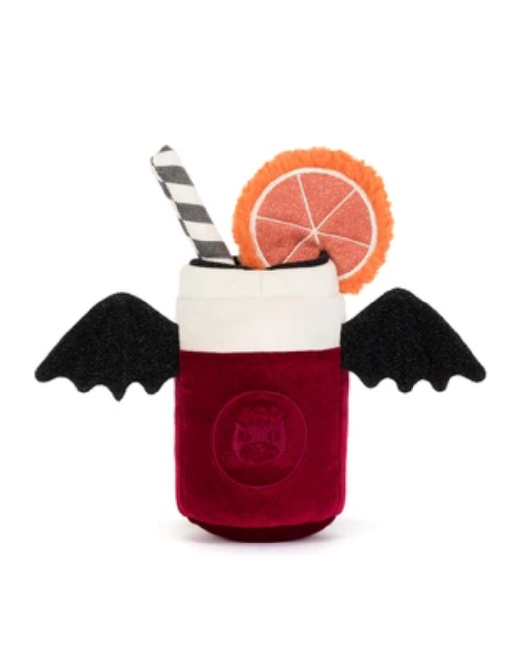 A plush dog toy shaped like a vampire cocktail in a red velvet cup, featuring black bat wings, a black-and-white striped straw, and an orange slice garnish, set against a plain white background.