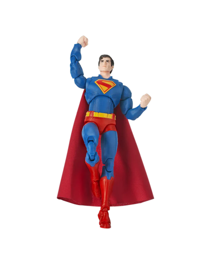 Superman action figure in a dynamic flying pose, featuring a blue suit, red cape, and red and yellow chest emblem, isolated on a white background.