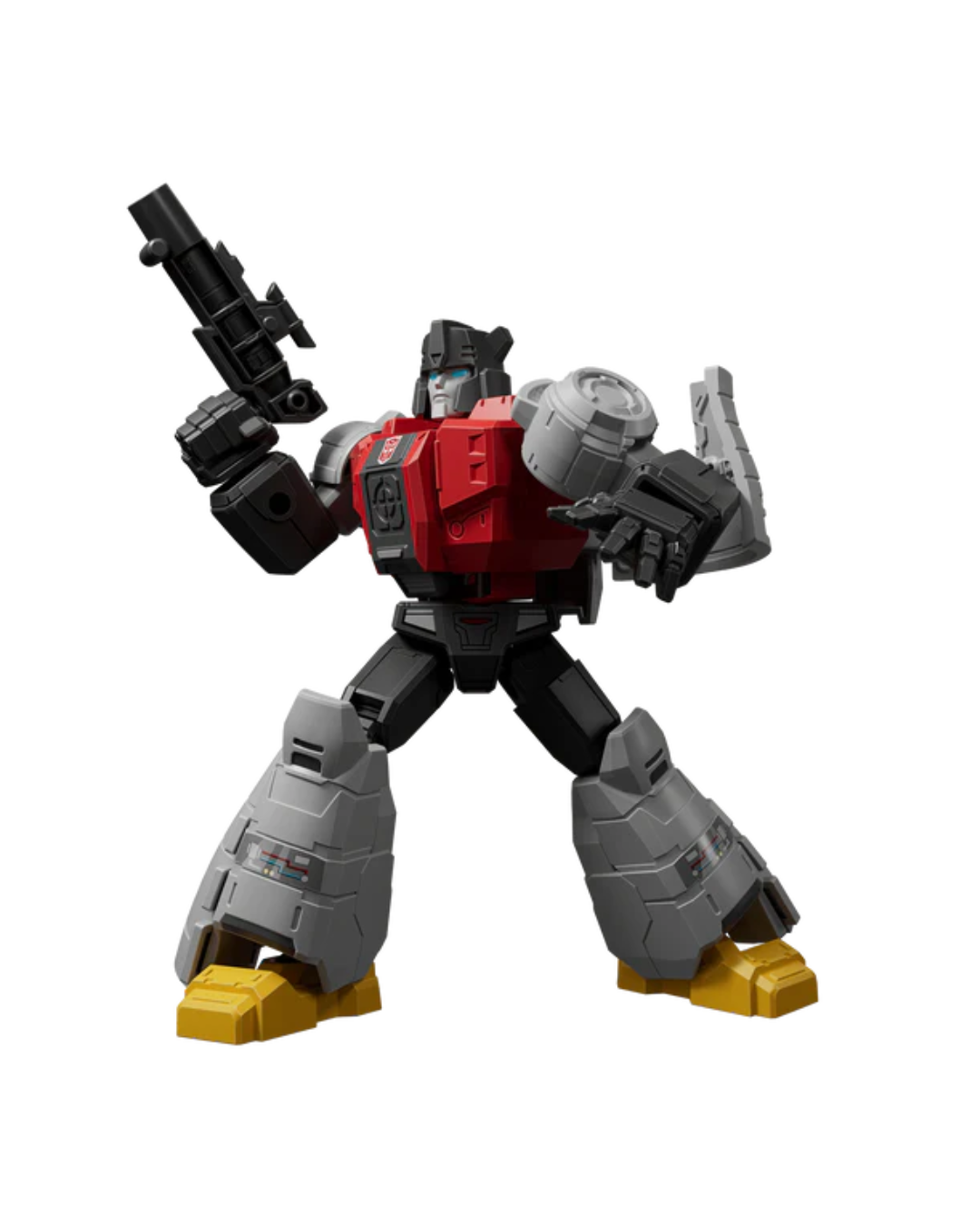 A transformers action figure with a red chest, black arms and legs, gray armor plating, and yellow feet, posed holding a black weapon against a plain white background.