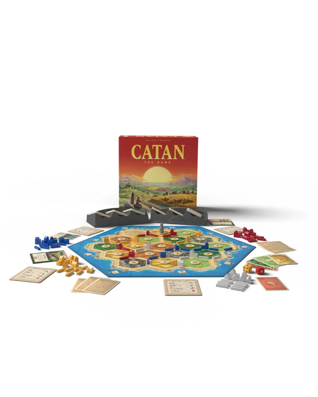 Catan board game set with the main game board, box, playmat, cards, and player tokens arranged on a white background.
