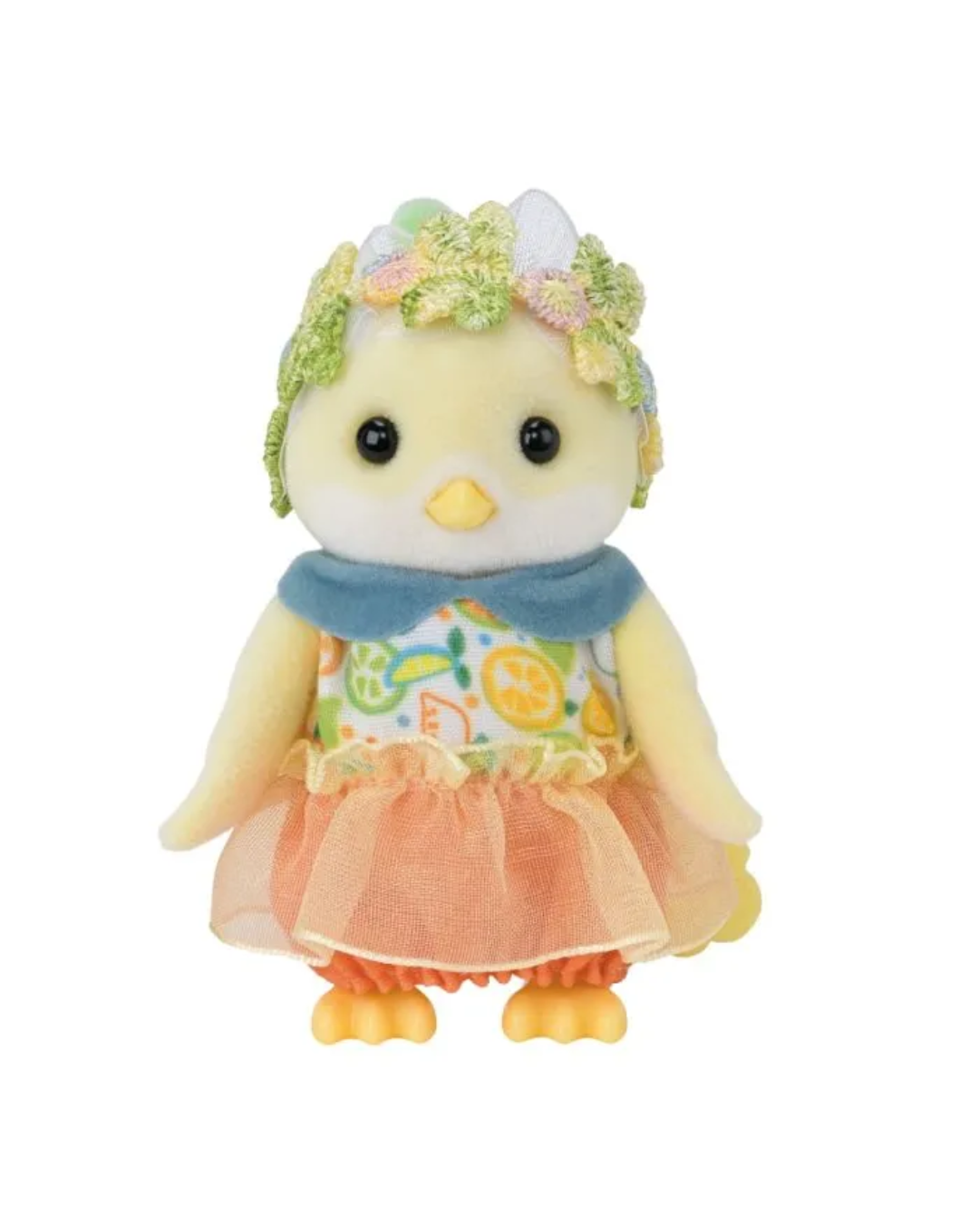A Sylvanian bird figurine with a yellow body, orange feet and beak, wearing a blue scarf, a patterned dress with a peach tulle skirt, and a pastel flower crown, isolated on a white background.