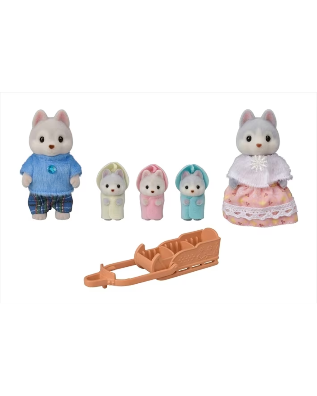 A Sylvanian Families toy set featuring a Huskey family with a white  mother in a pink and white dress, three small baby huskies in pastel outfits, father husky with blue sweater and an orange-brown plastic sled, all on a white background.