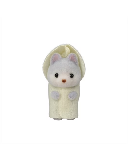 A baby sylvanian huskey wrapped in a cream-colored hooded blanket or pouch, with black eyes, a small pink nose, and pale pink inner ears, centered on a plain white background.