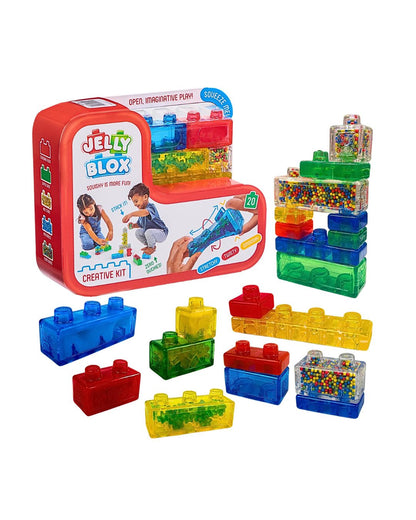 Jelly Blox Creative Kit toy set with a red storage box, colorful translucent building blocks, and clear blocks filled with small multicolored beads, shown on a white background.