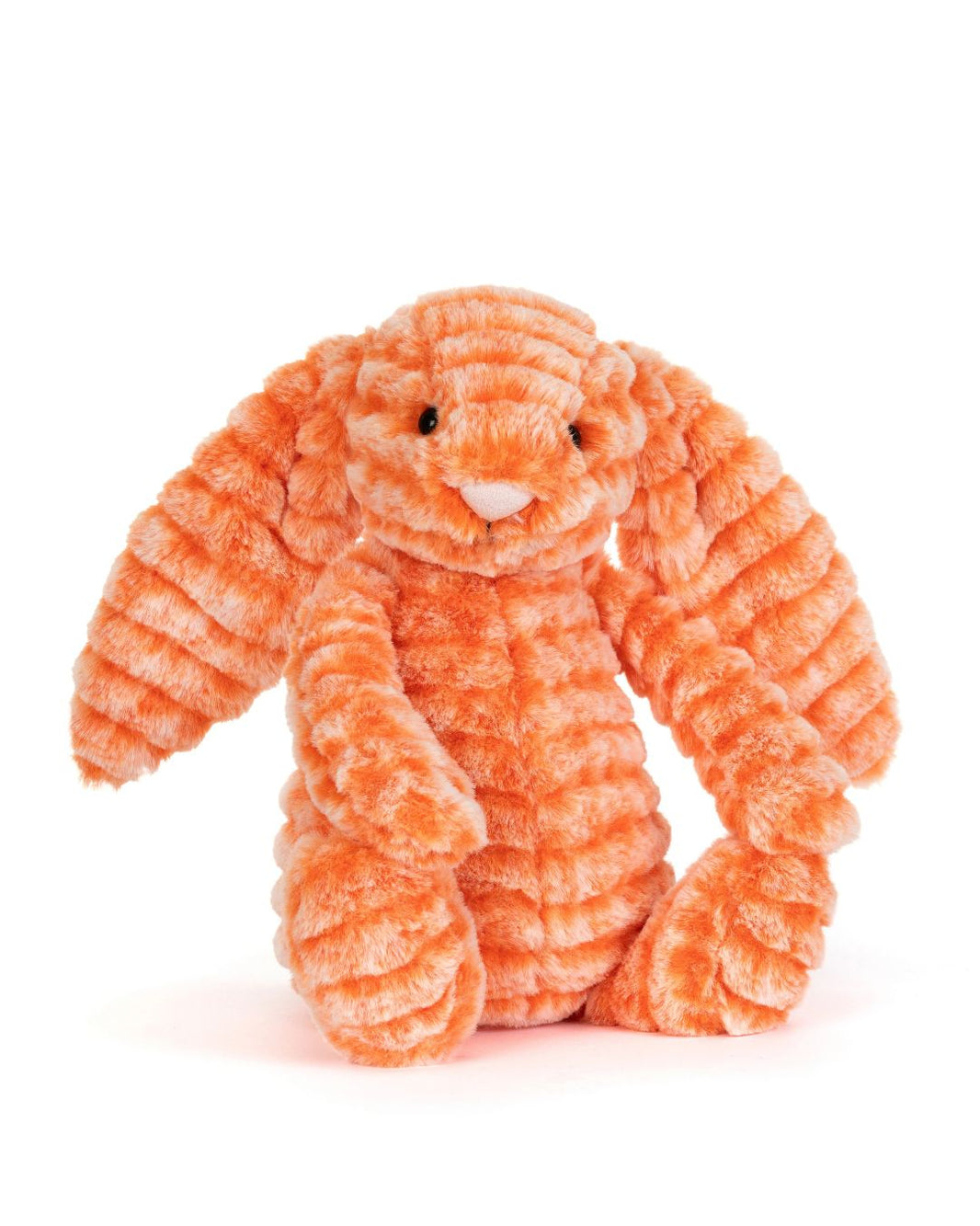 An orange Jellycat Fizzleskip Bunny toy with long floppy ears, small black eyes, and a white nose, photographed on a clean white background.