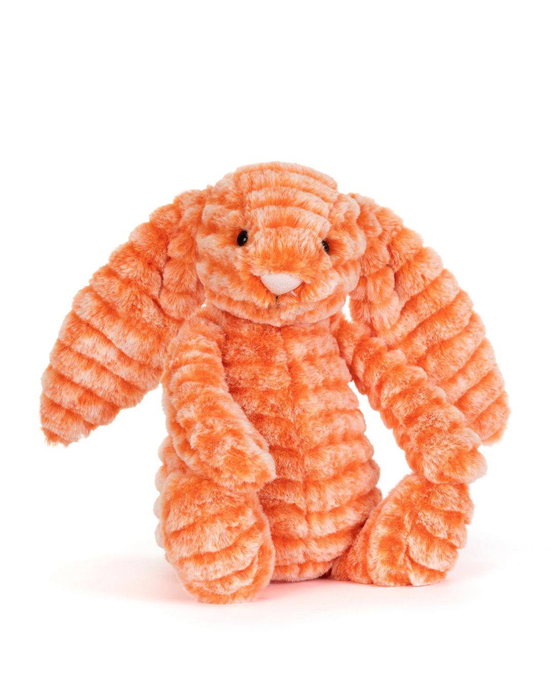 An orange Jellycat Fizzleskip Bunny toy with long floppy ears, small black eyes, and a white nose, photographed on a clean white background.