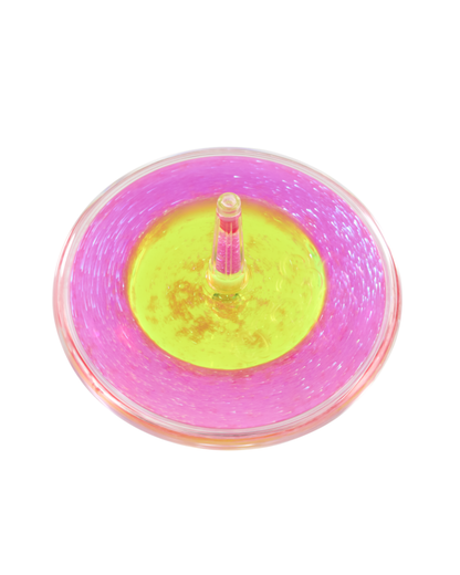 A Lava Storm spinner top with a bright pink outer ring and a neon yellow center, shown from a top-down view on a plain white background.