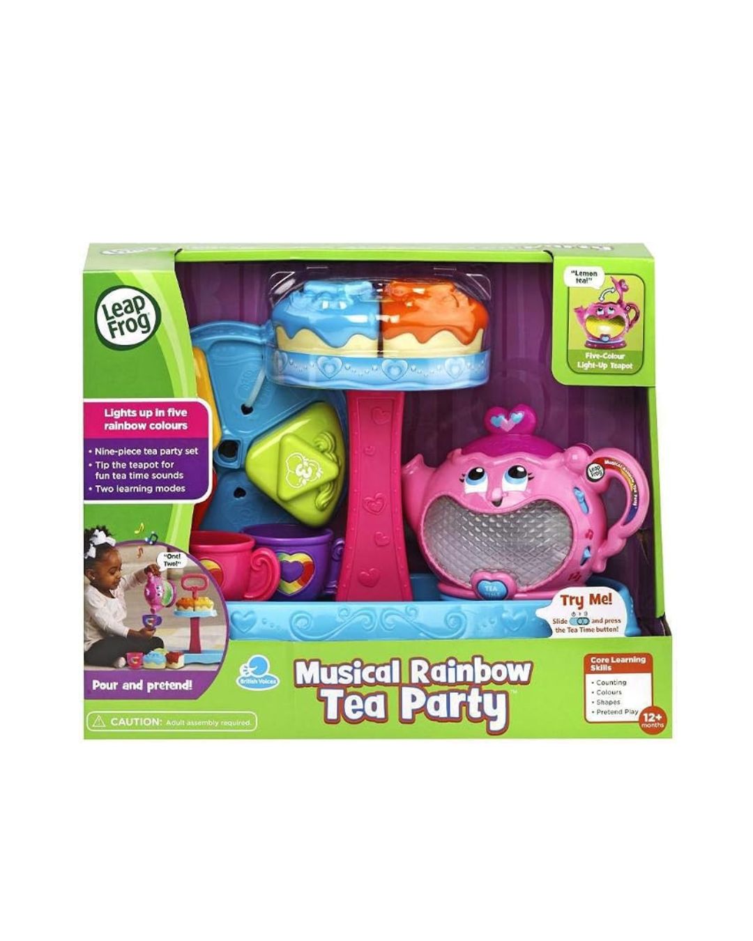 LeapFrog Musical Rainbow Tea Party toy set in its original retail packaging, featuring a pink teapot, blue and orange cups, and a rainbow-colored tea server inside a green and purple box.