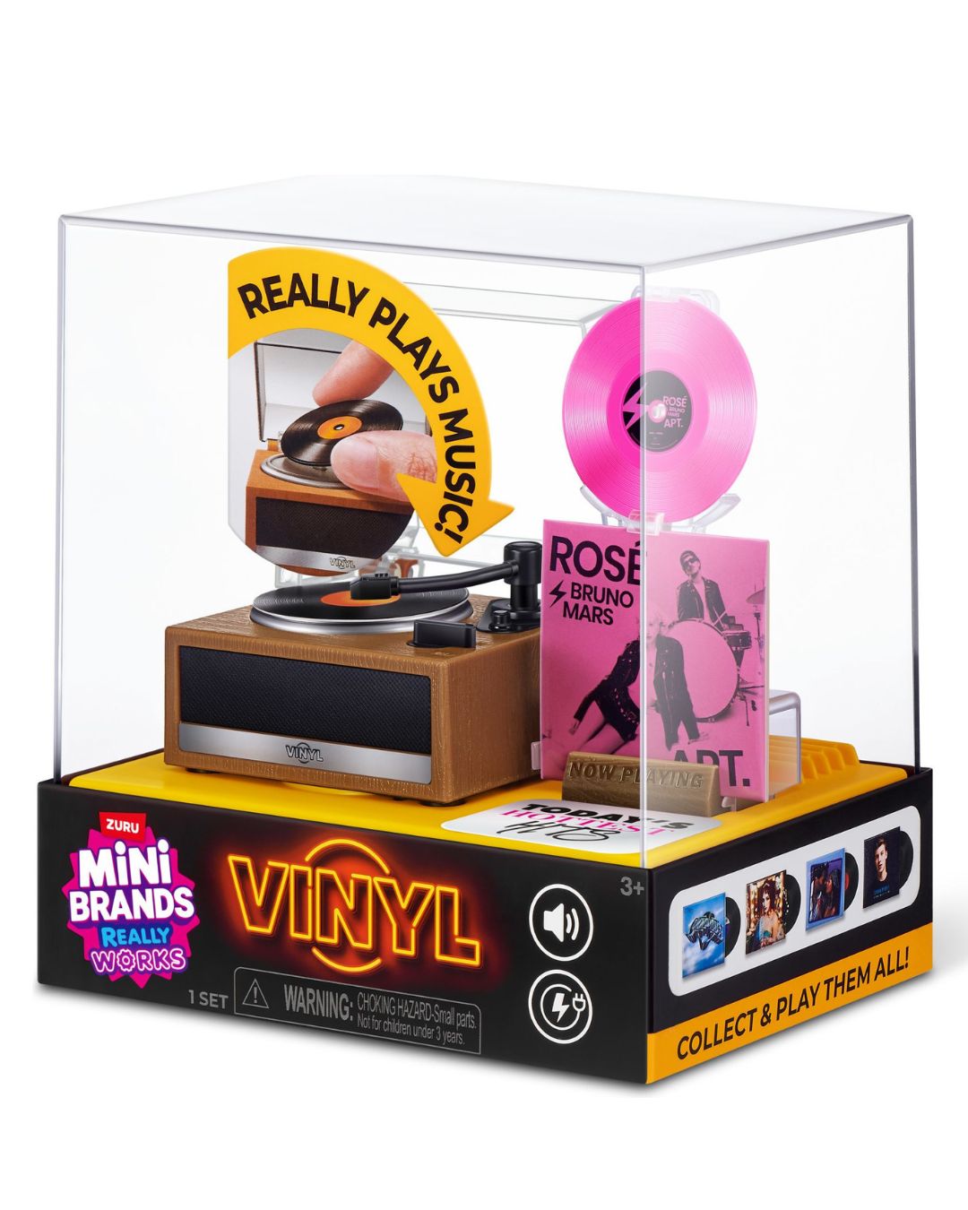 Mini Vinyls Really Wiggles toy set in a clear acrylic display case on a black and yellow retail box. The set includes a wooden turntable with a pink vinyl record, a pink rose-colored CD case, and a pink vinyl disc inside the case.