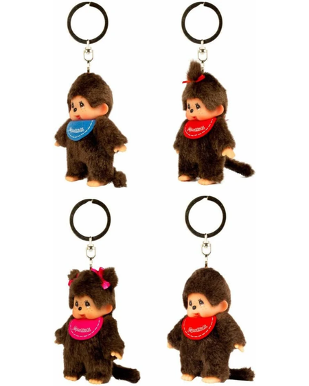 Four mini Monchhichi plush keychains arranged in a 2x2 grid on a white background, featuring different colored bibs (blue, red, and pink) and hair bows.