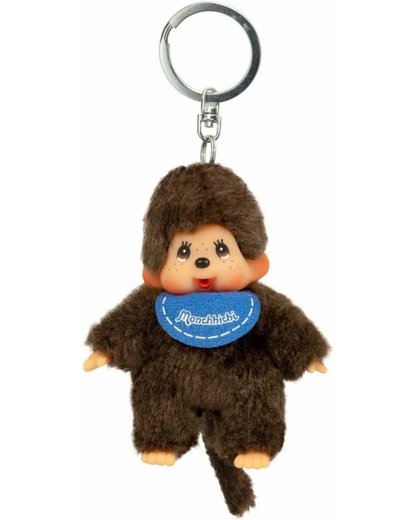A small brown monkey keychain charm with a silver metal key ring, featuring a blue bib with the brand name 'Monchhichi' on a plain white background.