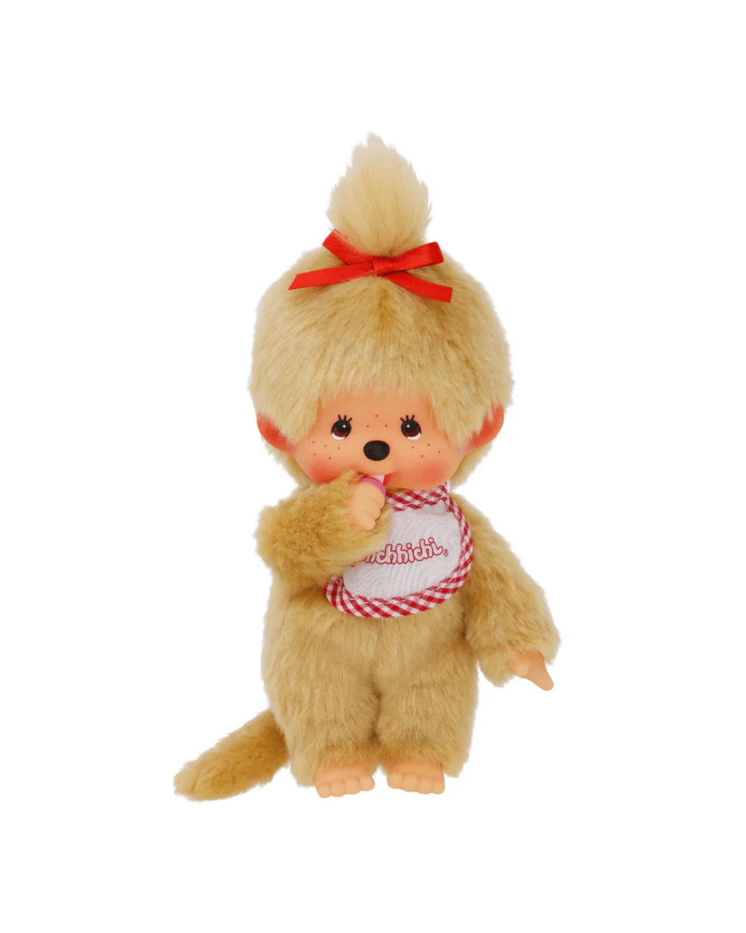 A Monchhichi doll with golden-blonde fur, a red bow in its hair, and a white bib with red gingham trim and the word 'monchichi' on it, photographed against a plain white background.