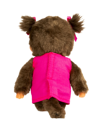 A brown plush Monchhichi viewed from the back, wearing a bright pink vest and small pink bows in its pigtails, isolated on a white background.