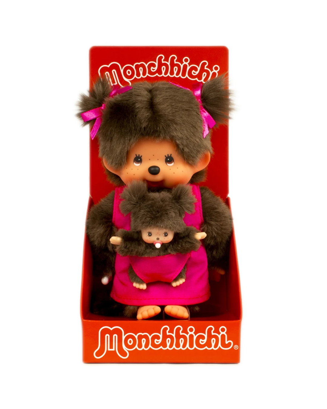A Monchhichi toy set in its original red display box, featuring a larger brown plush chimp holding a smaller matching plush chimp. The box has the 'Monchhichi' brand name printed in white on the top and bottom.