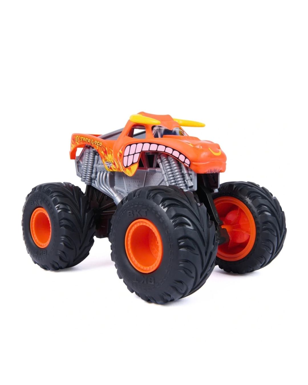 An orange monster truck toy rev n roar el toro loco black off-road tires, bright orange wheel centers, and a cartoonish toothy grille on the front, shown on a plain white background.
