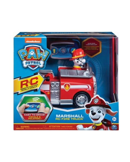 PAW Patrol Marshall RC Fire Truck toy in its original retail packaging, featuring a red and silver fire truck with a dog driver and remote control instructions.