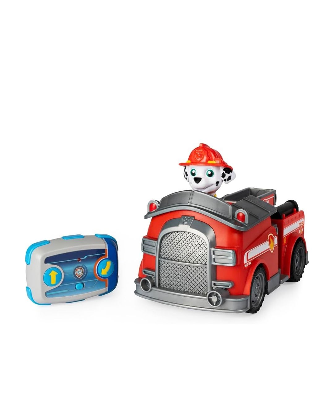 A Paw Patrol Marshall Fire Truck red toy fire truck with a dalmatian dog character sitting inside, shown alongside a blue and gray remote control on a plain white background.