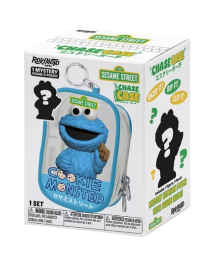 A boxed set of mystery figures featuring Sesame Street characters, including Cookie Monster, shown in its retail packaging on a white background.