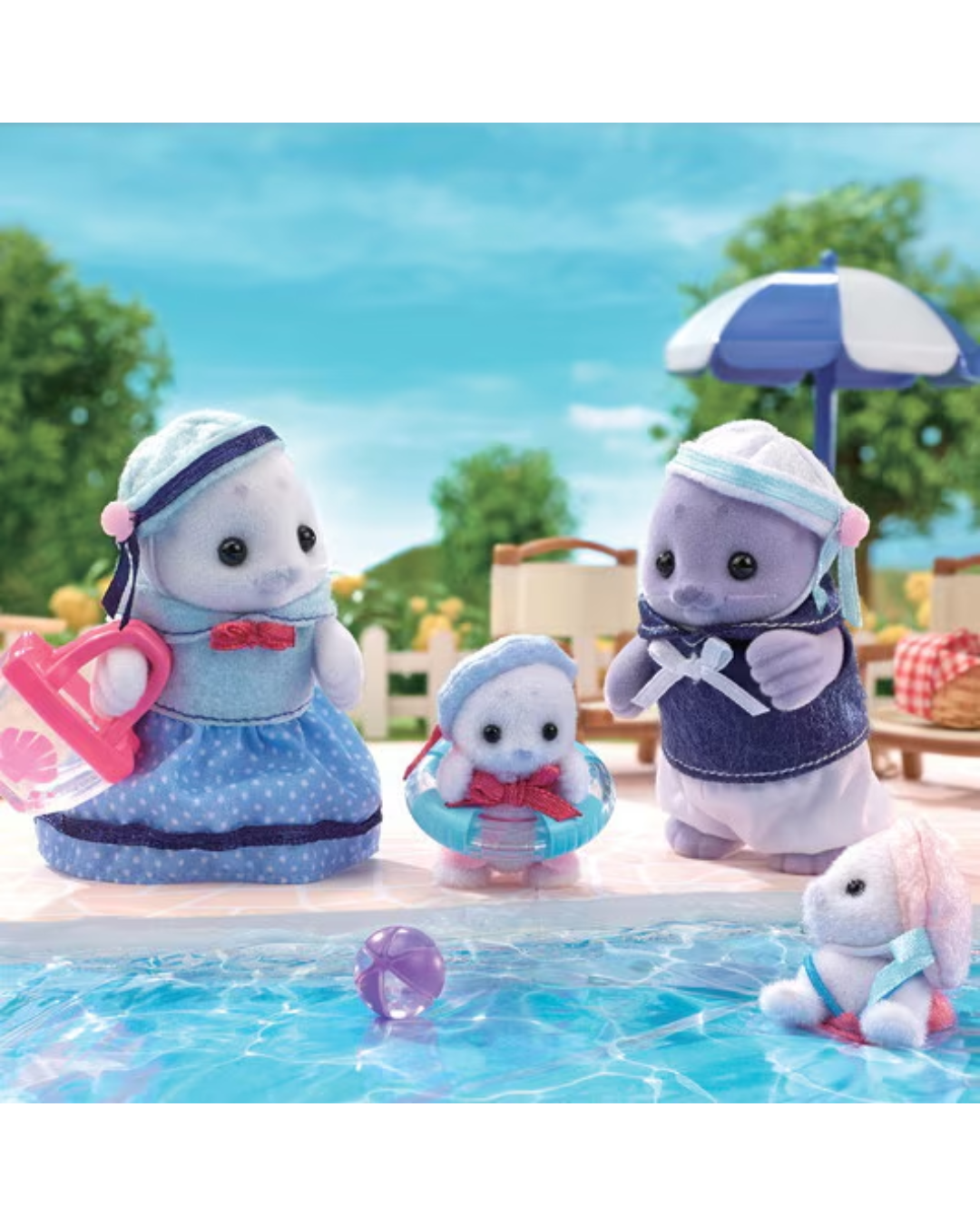 Sylvanian Families Seal Family of four wearing marine themed outfits. The family contains  mother, father and two cubs. The figures are shown in front of a pool where a baby seal is swimming.