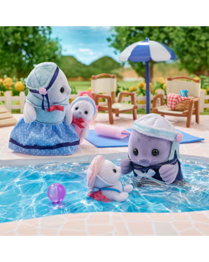 Sylvanian Families Seal Family of four wearing marine themed outfits. The family contains  mother, father and two cubs. The figures are shown in front of a pool where a baby seal and father are swimming
