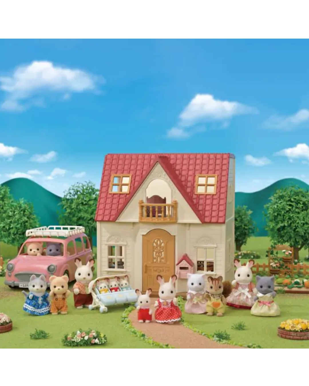 A Sylvanian Families toy set featuring a two-story house with a red roof, several animal characters in clothing, a pink car, and a garden scene under a blue sky.