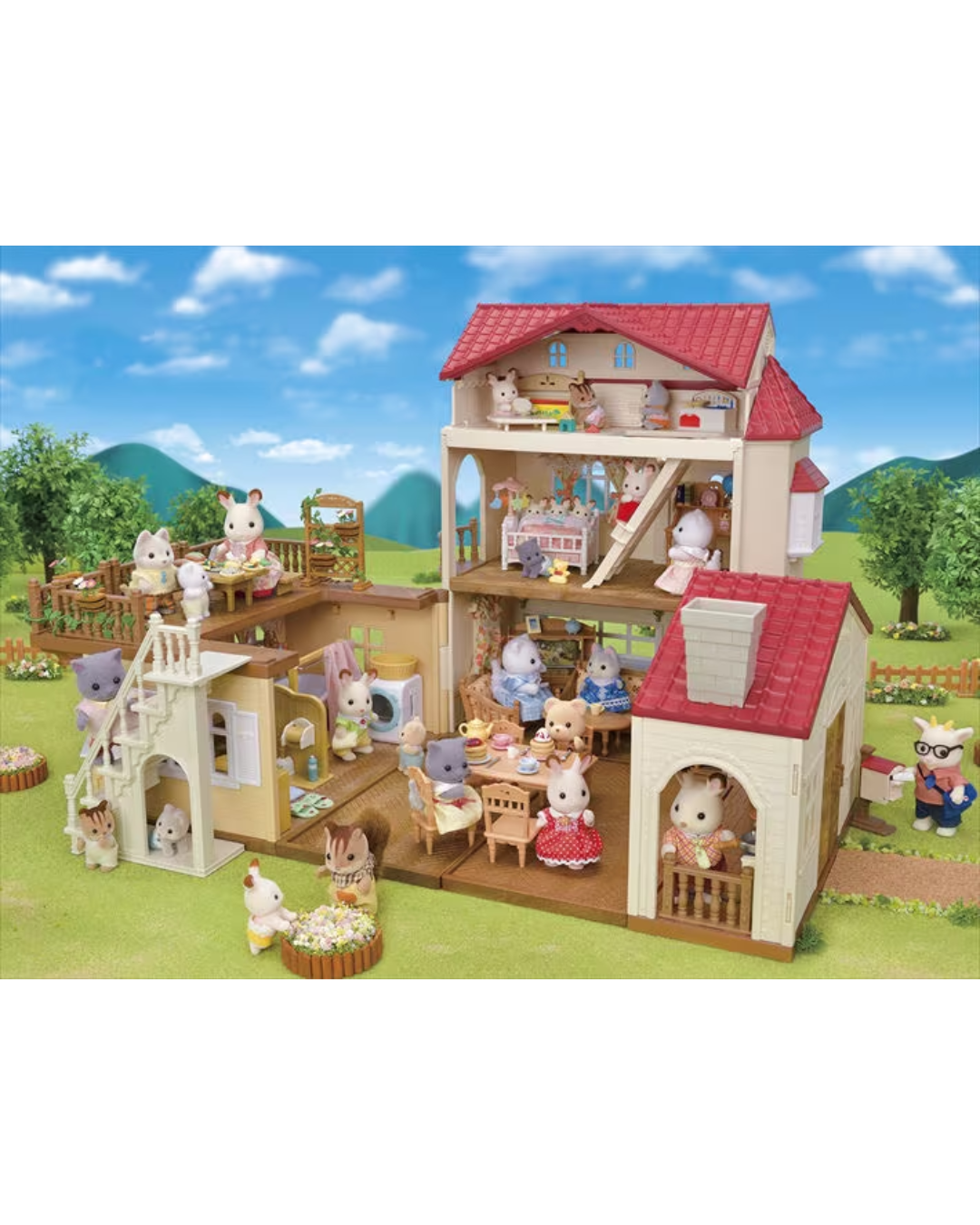 A Sylvanian Families multi-level animal playset dollhouse with several small animal characters arranged inside and around the house on a grassy outdoor scene backdrop.