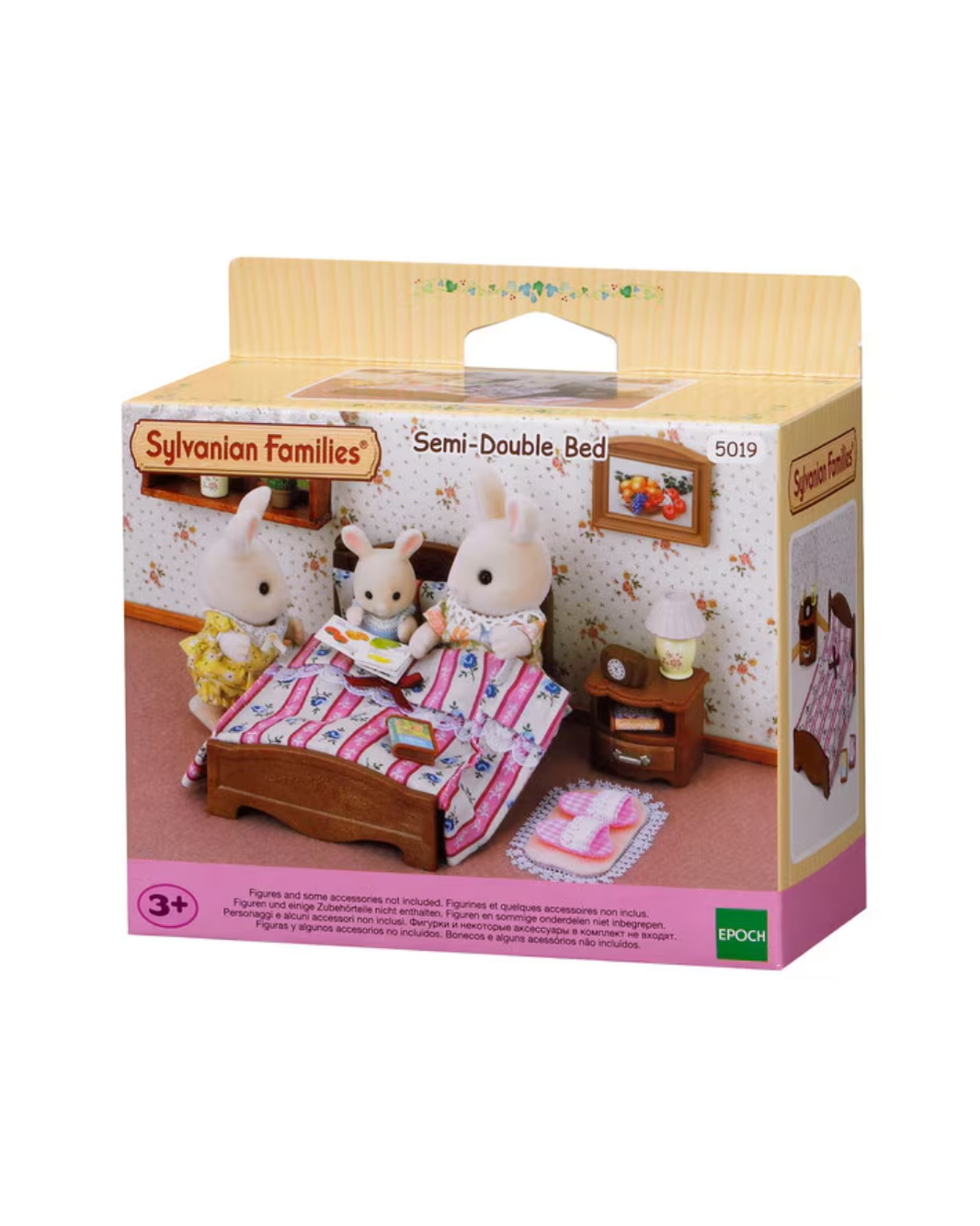 Sylvanian Families Semi-Double Bed toy set in its original retail packaging, featuring a miniature bed with a pink and white striped cover, a small wooden nightstand, and animal characters in a cozy room scene.