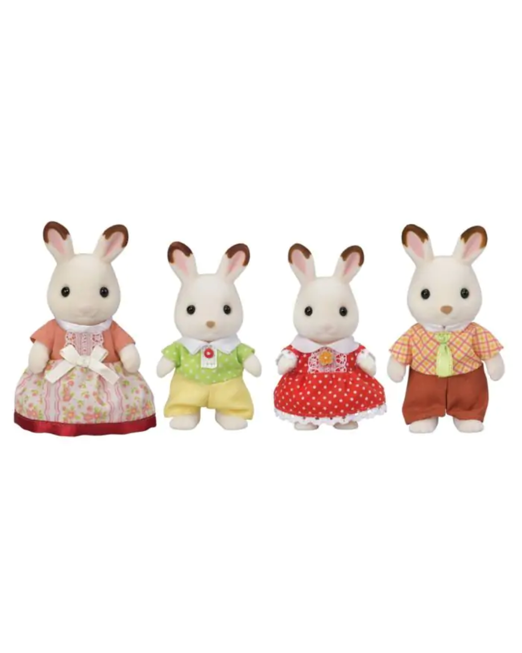 Four Sylvanian Family toy rabbits standing side by side on a plain white background. The family set includes a mother rabbit in a pink floral dress, a father rabbit in a green shirt and yellow pants, a young girl rabbit in a red polka-dot dress, and a boy rabbit in an orange check shirt and brown pants.