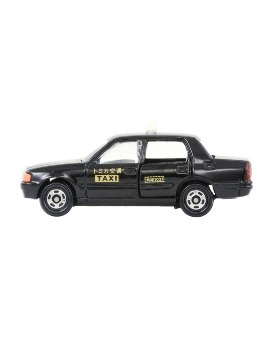 Tomica Tamiya 1:63 scale model car for a No. (51) Toyota Crown Comfort Taxi featuring a black taxi illustration on a white background, with yellow accents and japanese writing. 