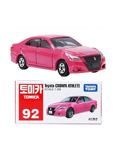 A pink No. (92) Tomica Toyota Crown Athlete scale 1:66 diecast model car shown above its original packaging box on a plain white background.
