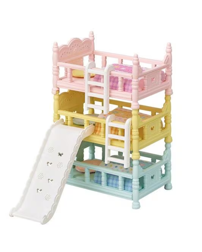 A multi-level sylvanian bunk bed with a slide, shown on a plain white background. The bed features pastel pink, yellow, and light blue levels with white railings and ladders.