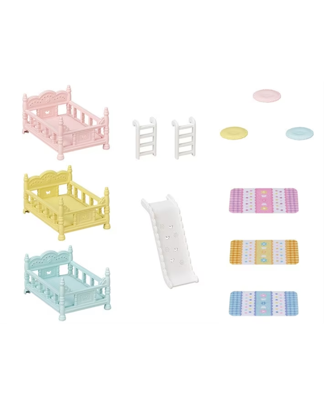 A miniature dollhouse playset featuring three small cribs in pastel pink, yellow, and light blue, a white slide, two white ladders, and several colorful mats and round discs on a plain white background.
