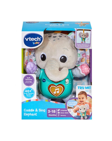 VTech Baby Cuddle & Sing Elephant toy in its original retail packaging, featuring a plush elephant with a teal vest and colorful activity panels.