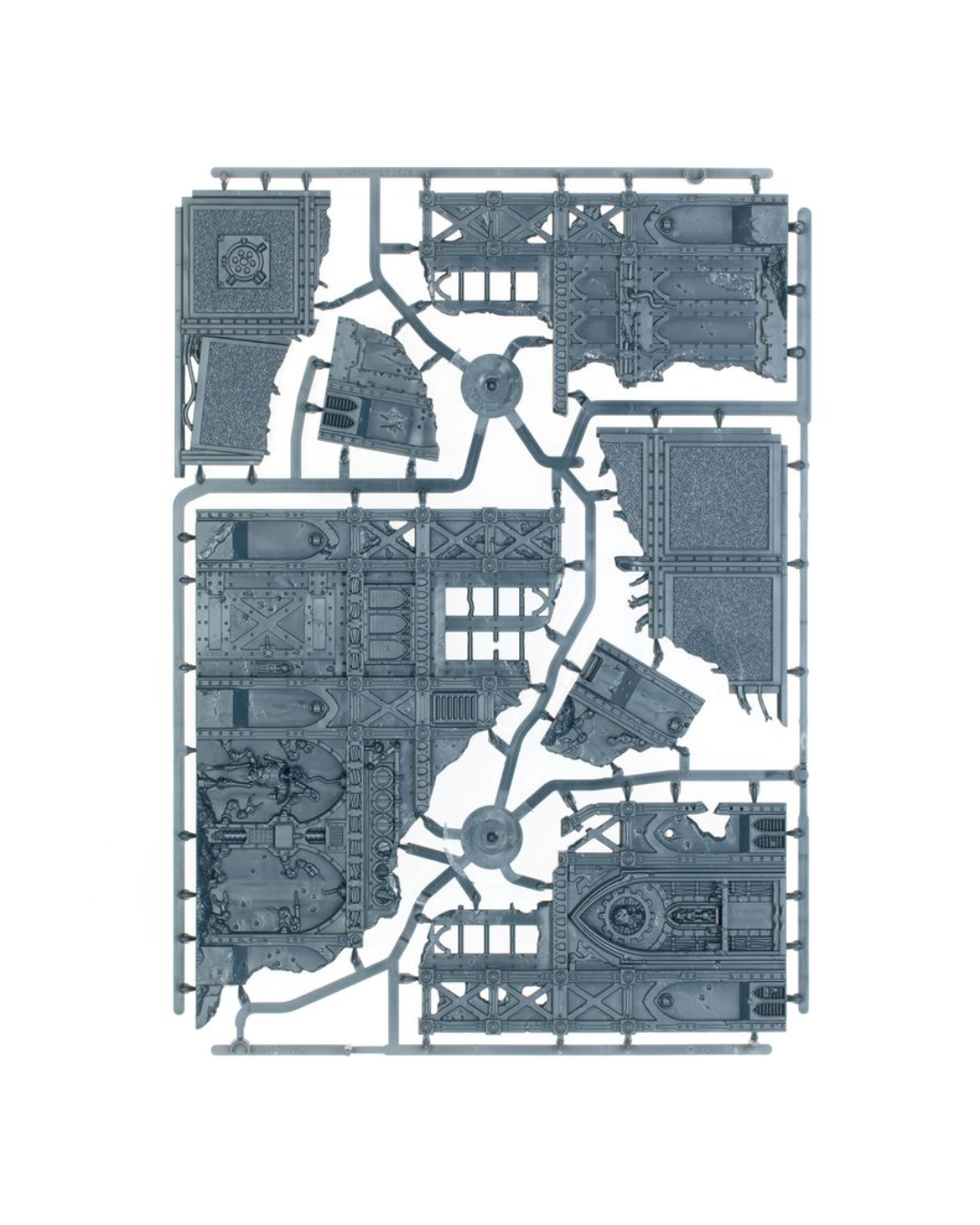 A flat-lay view of a Warhammer gray plastic sprue containing multiple miniature terrain pieces for tabletop wargaming, isolated on a white background.