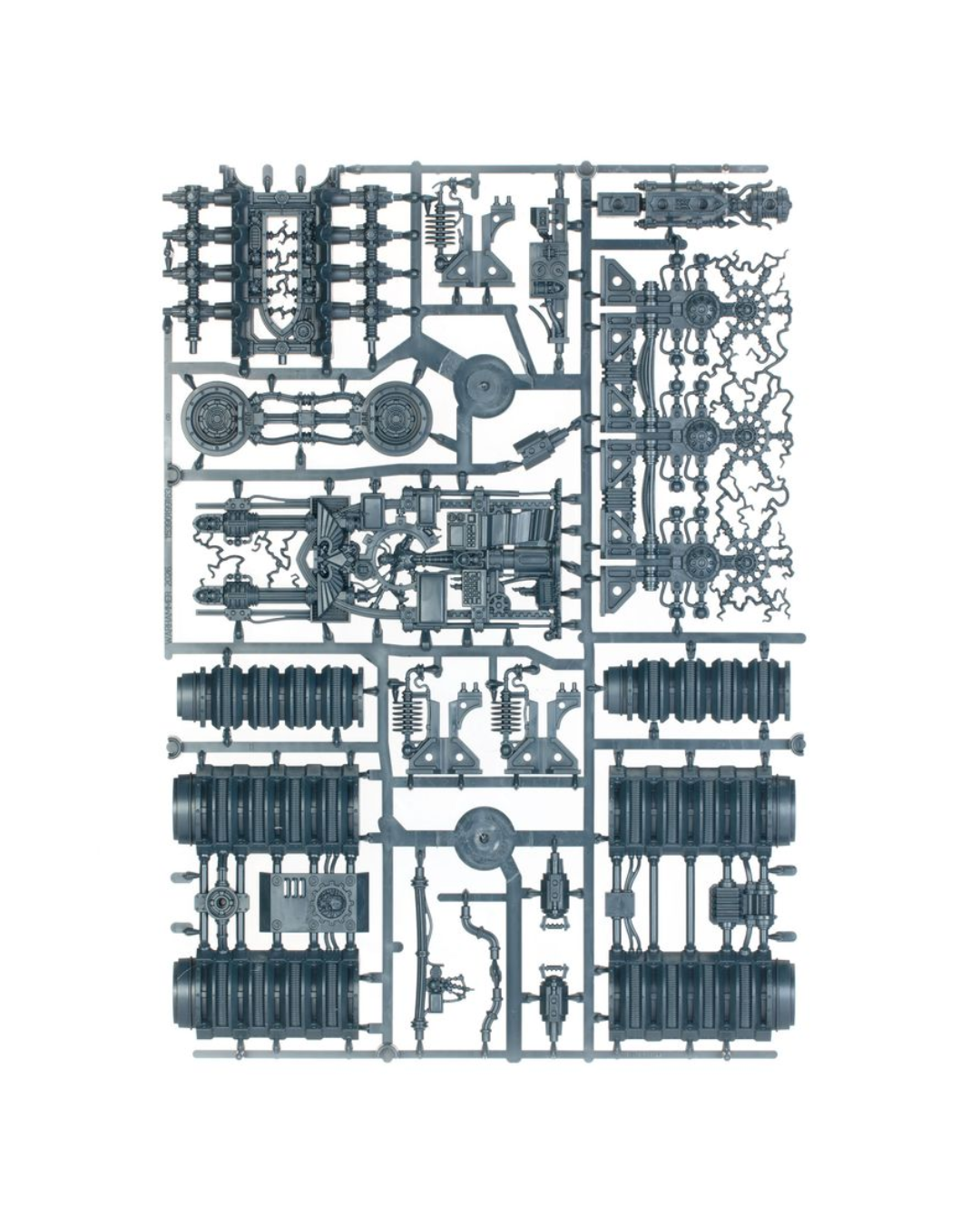 A flat-lay view of a miniature plastic model kit sprue containing various gray mechanical parts, cylinders, and components on a white background.
