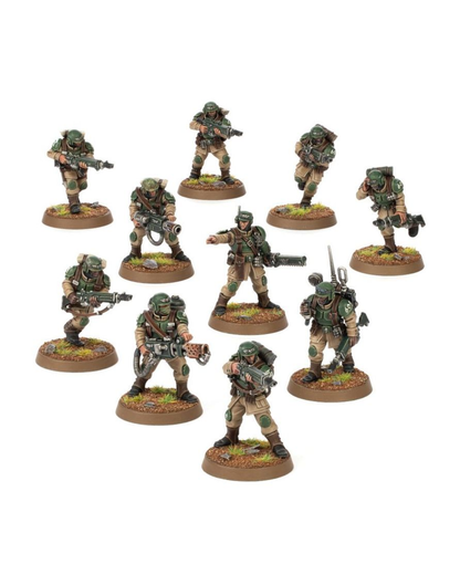 A set of nine painted miniature soldier figures in desert camouflage uniforms, posed dynamically across a plain white background.