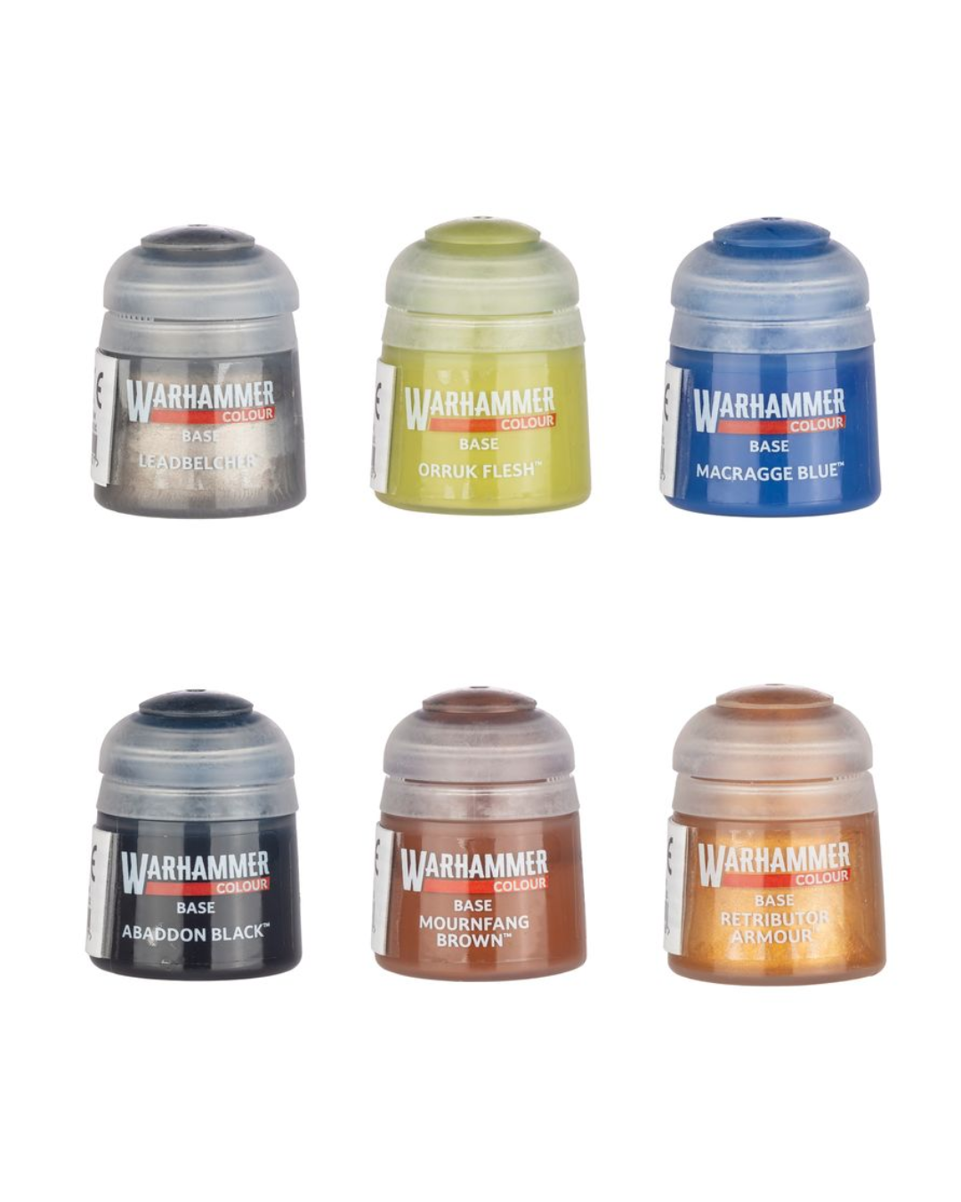Six small Warhammer 40k Base Set acrylic paint pots arranged in two rows on a plain white background. The pots contain different paint colors: black, olive green, blue, dark gray, brown, and copper.