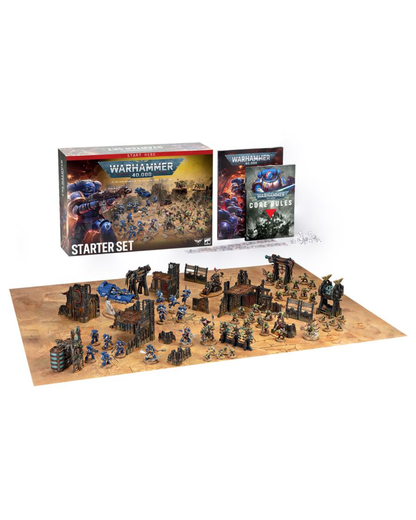 Warhammer 40k Starter Set tabletop gaming kit on a white background, showing the main starter box, rulebook, terrain board, and painted miniatures and structures.
