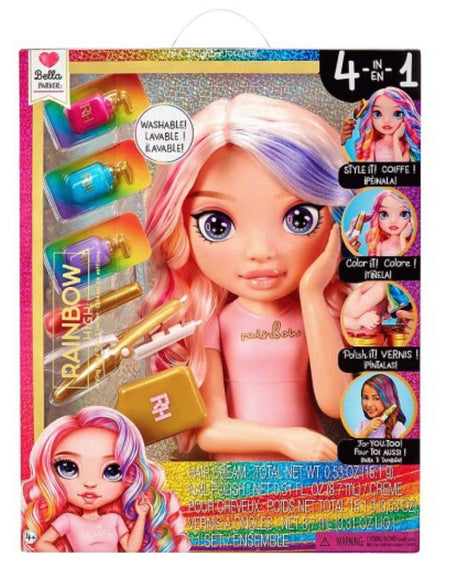 Rainbow Planet Bella Barbie 4-in-1 doll playset in its original retail packaging, featuring a pink-haired doll with pastel rainbow hair, a pink dress, and included accessories like colorful bottles, a gold makeup bag, and styling tools.